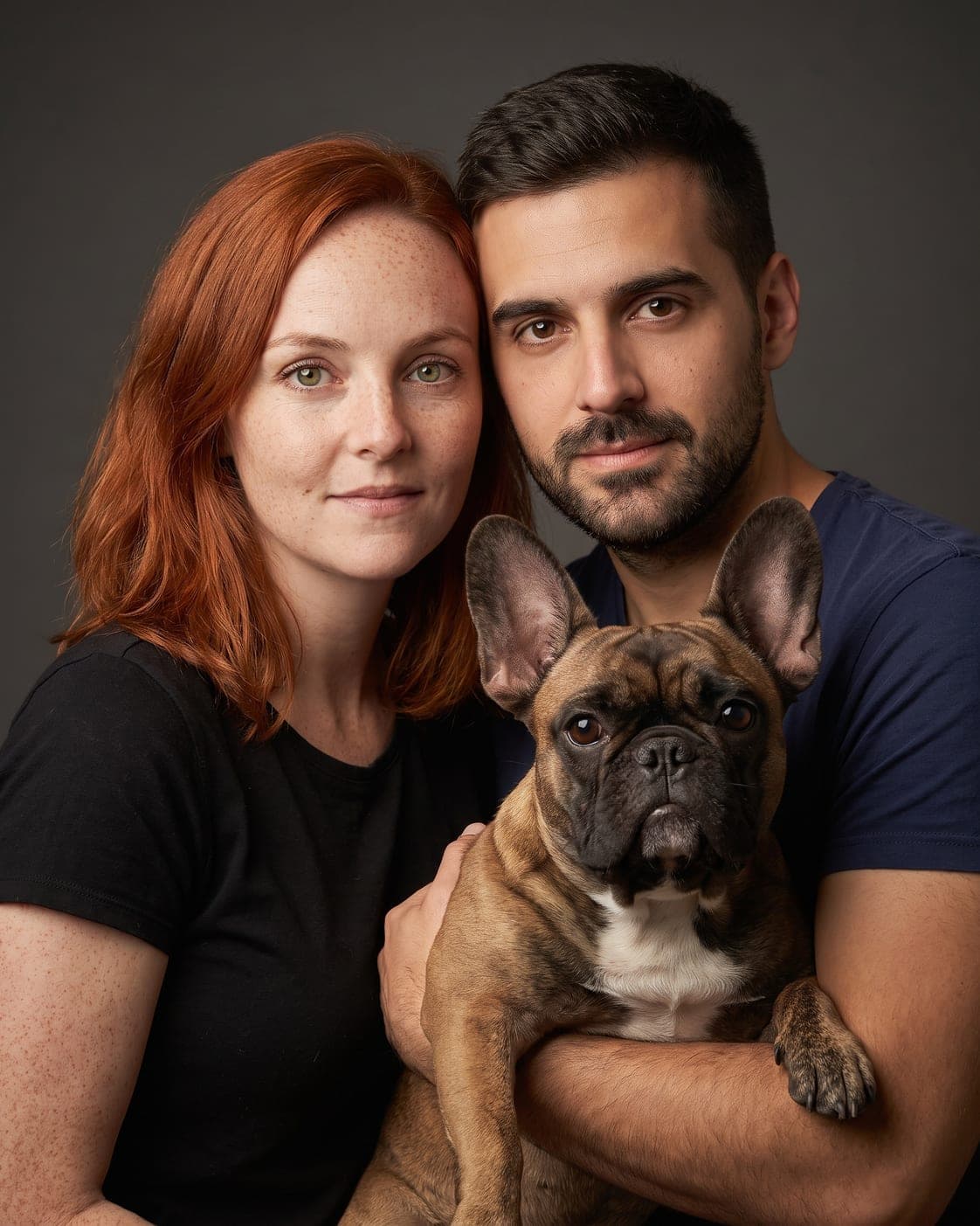 The three of us — Standing together, one of you holding them.