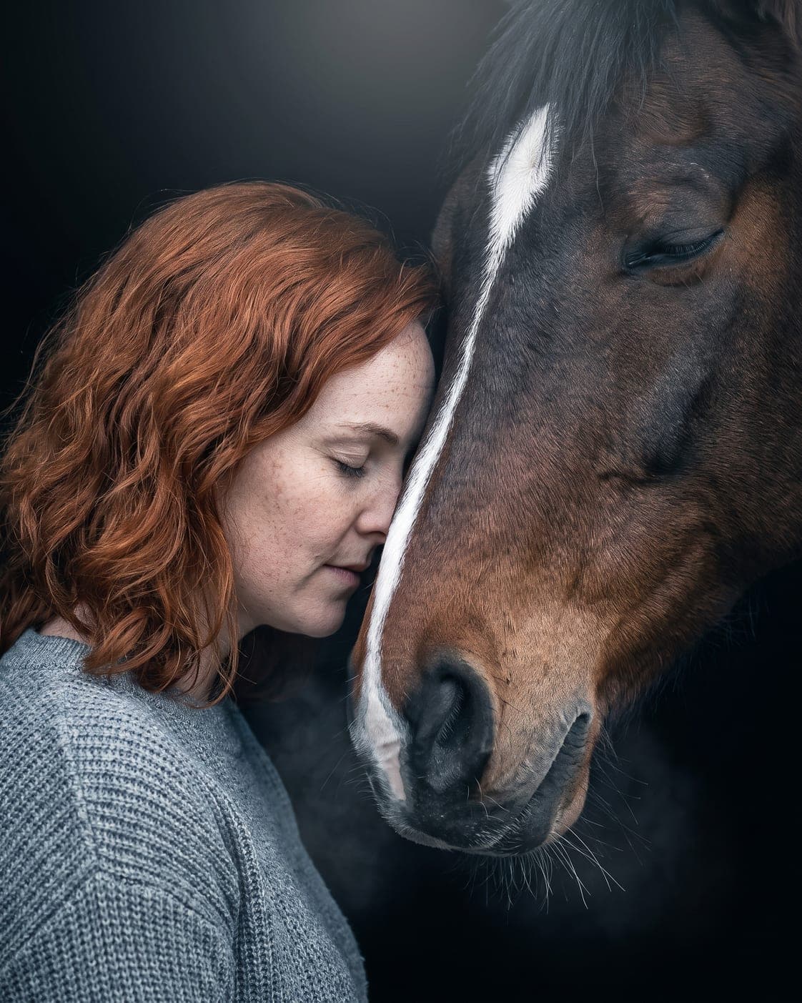 Forehead to muzzle — Your head against theirs, both of you with your eyes closed.